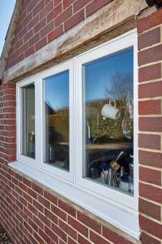 PR1974 Close up of the flush fitting REHAU Nordic Design Plus installed in a cottage setting