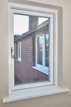 PR1974 Interior view of the flush fitting REHAU Nordic Design Plus installed in a cottage setting